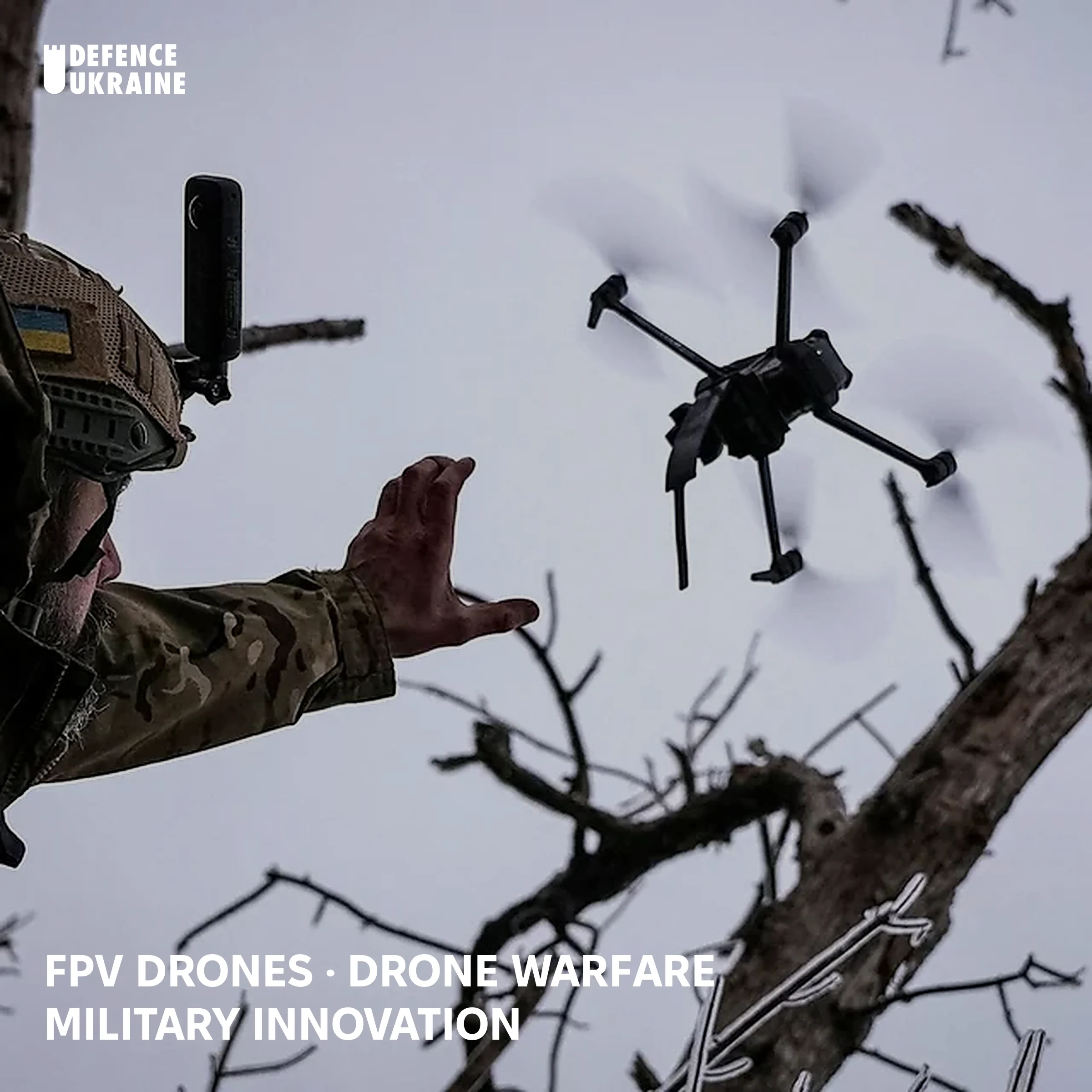 A Ukrainian soldier in military uniform releases a quadcopter FPV drone mid-air during a winter operation in forested terrain, illustrating the commercially-derived strike platform now central to Ukrainian battlefield tactics.